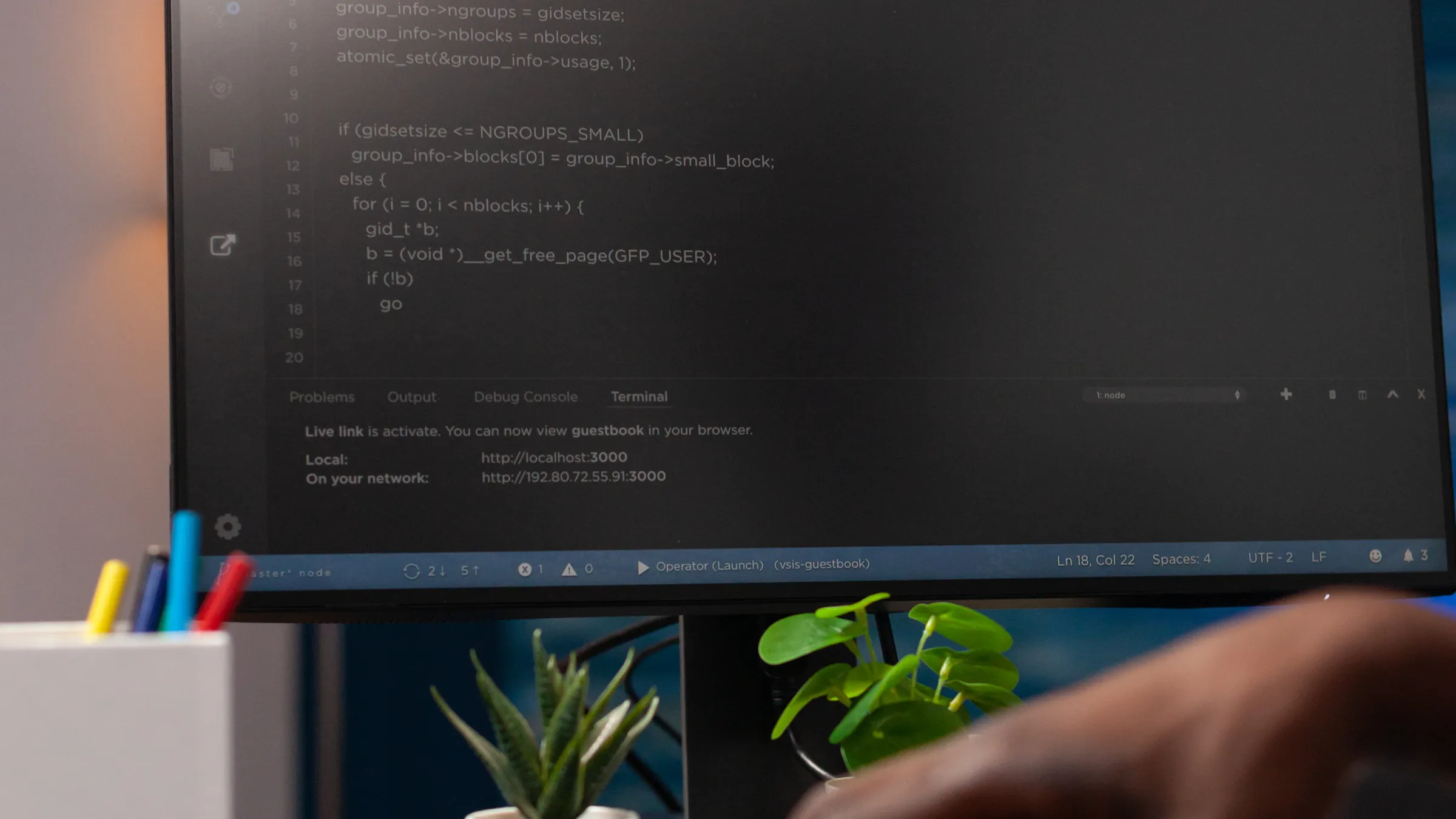 Code on a monitor as a developer works on network security